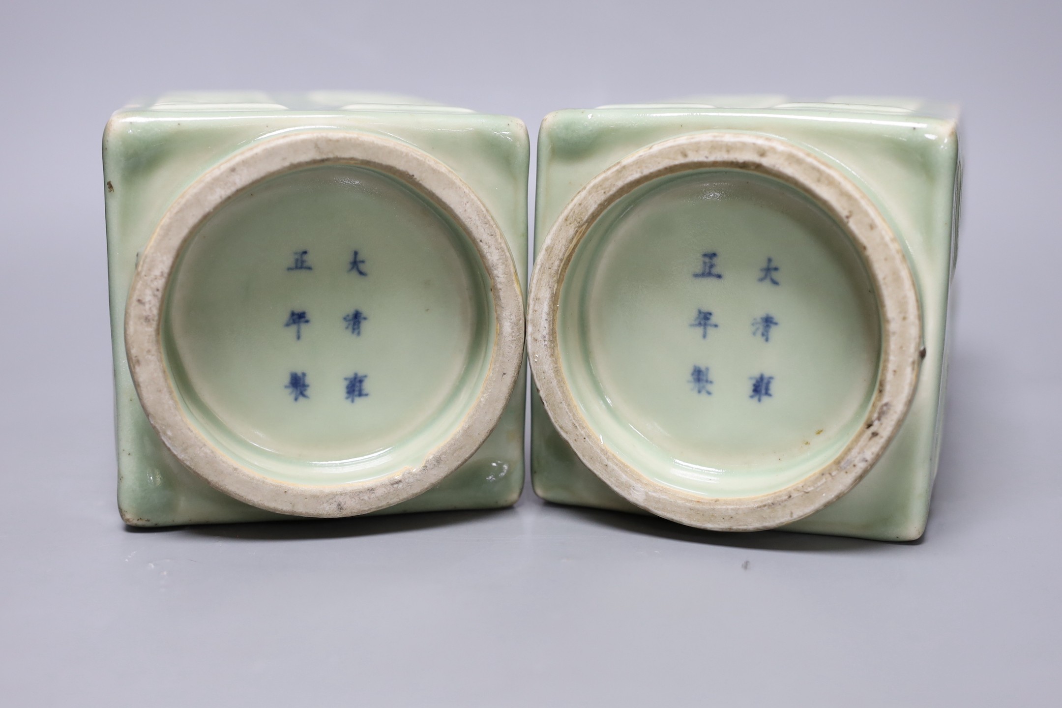 A pair of early 20th century Chinese celadon glazed eight trigrams cong vases, 25cm